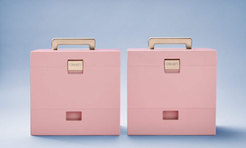 OSHEN Makeup Case. Set of two. Muted pink with rose gold accents. The first makeup storage case made with recycled ocean-bound plastic.